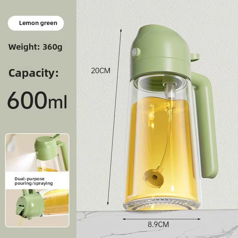 Glass oil dispenser standing on kitchen shelf with decor