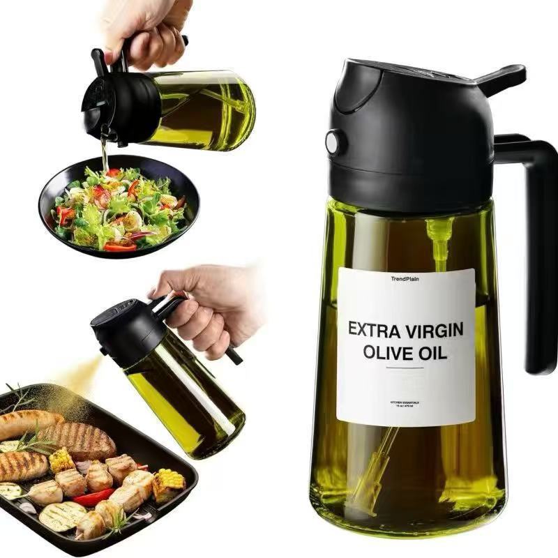 Glass oil dispenser and sprayer next to stovetop and spices